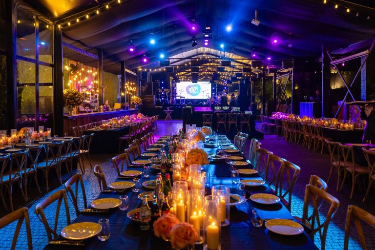 Candlelit tables at an evening event