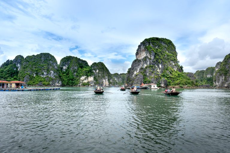 Boats among limestone islands in Ha Long Bay